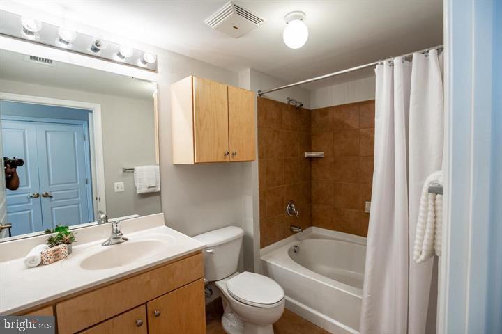 616 E Street Northwest, Unit 655 Washington, DC 20004 - Photo 23 of 38 a bathroom with a sink a toilet and shower