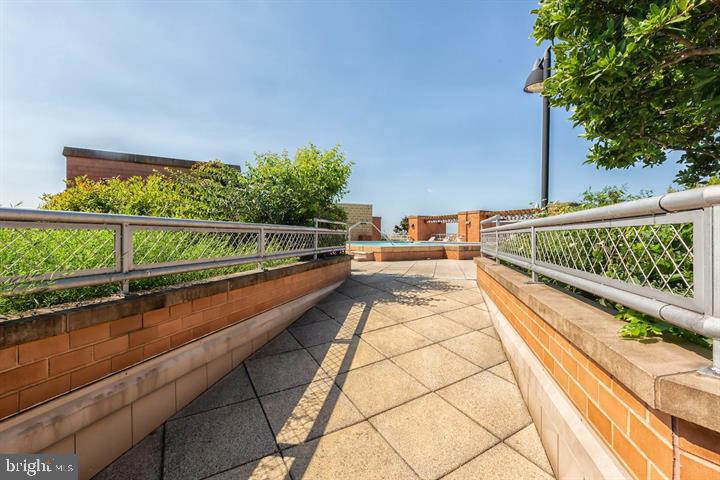 616 E Street Northwest, Unit 655 Washington, DC 20004 - Photo 25 of 38 a view of balcony with lots of potted plants