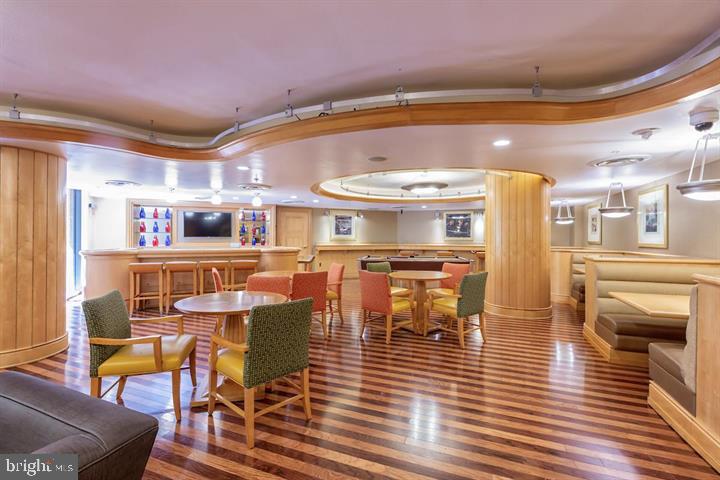 616 E Street Northwest, Unit 655 Washington, DC 20004 - Photo 33 of 38 a dining room with furniture and wooden floor