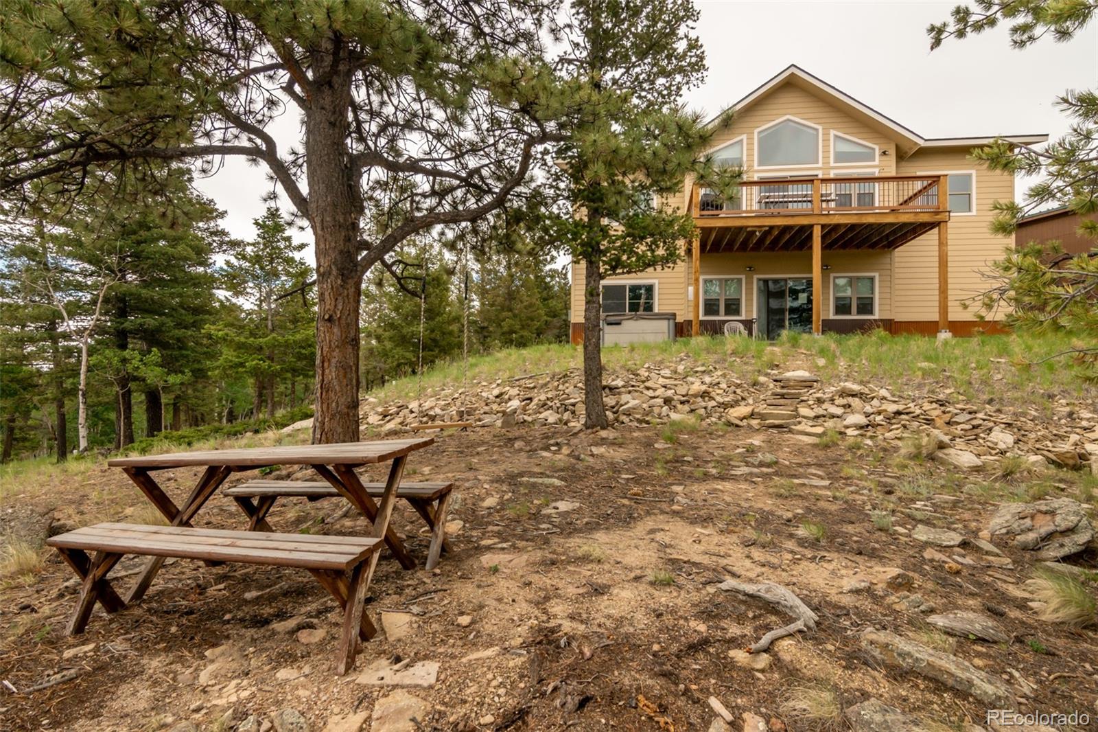 3900 Singletree Road Hartsel, CO 80449 - Photo 8 of 50 a view of a house with backyard and sitting area