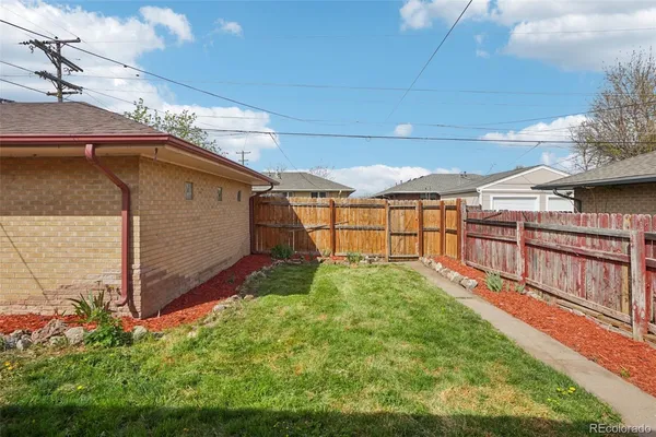 a view of backyard with tub and stairs