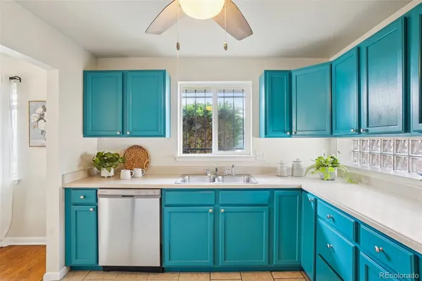 a kitchen with a sink and cabinets