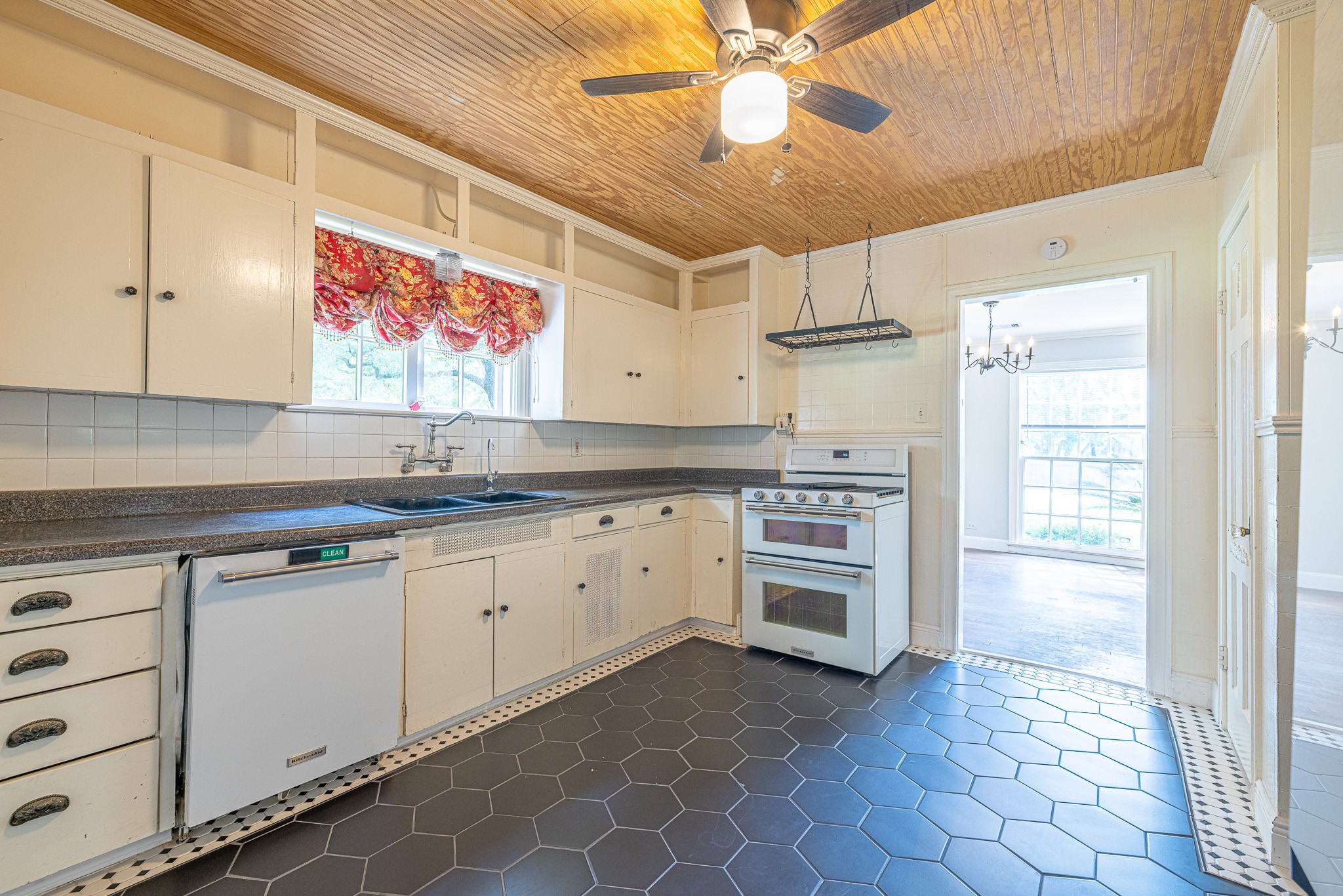 8548 Findlay Street Houston, TX 77017 - Photo 16 of 50 a kitchen with stainless steel appliances a stove a sink and a refrigerator