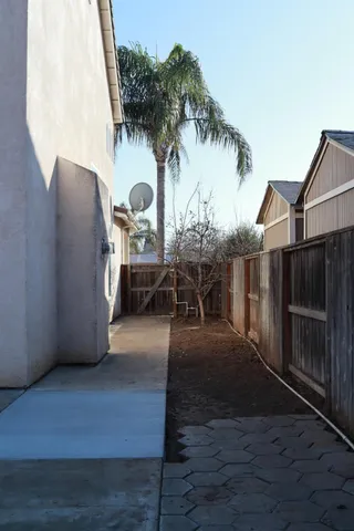 a view of wooden door and a yard
