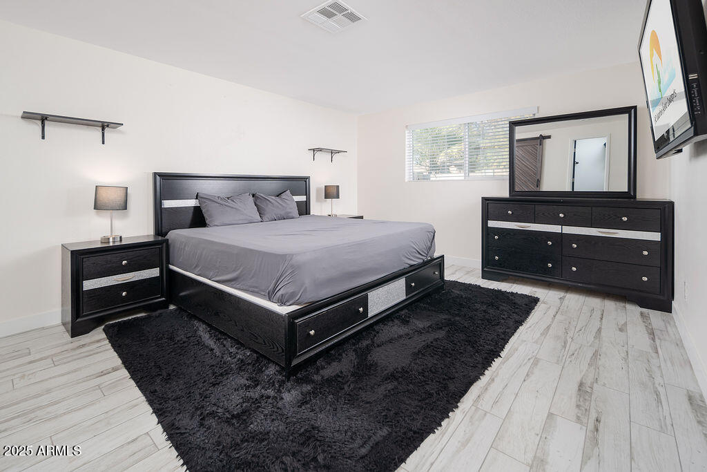 3314 East Cypress Street Phoenix, AZ 85008 - Photo 12 of 23 Primary bed, king with TV
