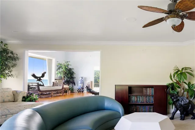 a large kitchen with a large window and stainless steel appliances