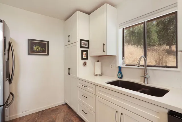 a view of bathroom with dual sinks