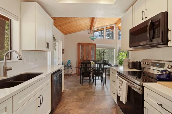 a spacious bathroom with a toilet sink and mirror