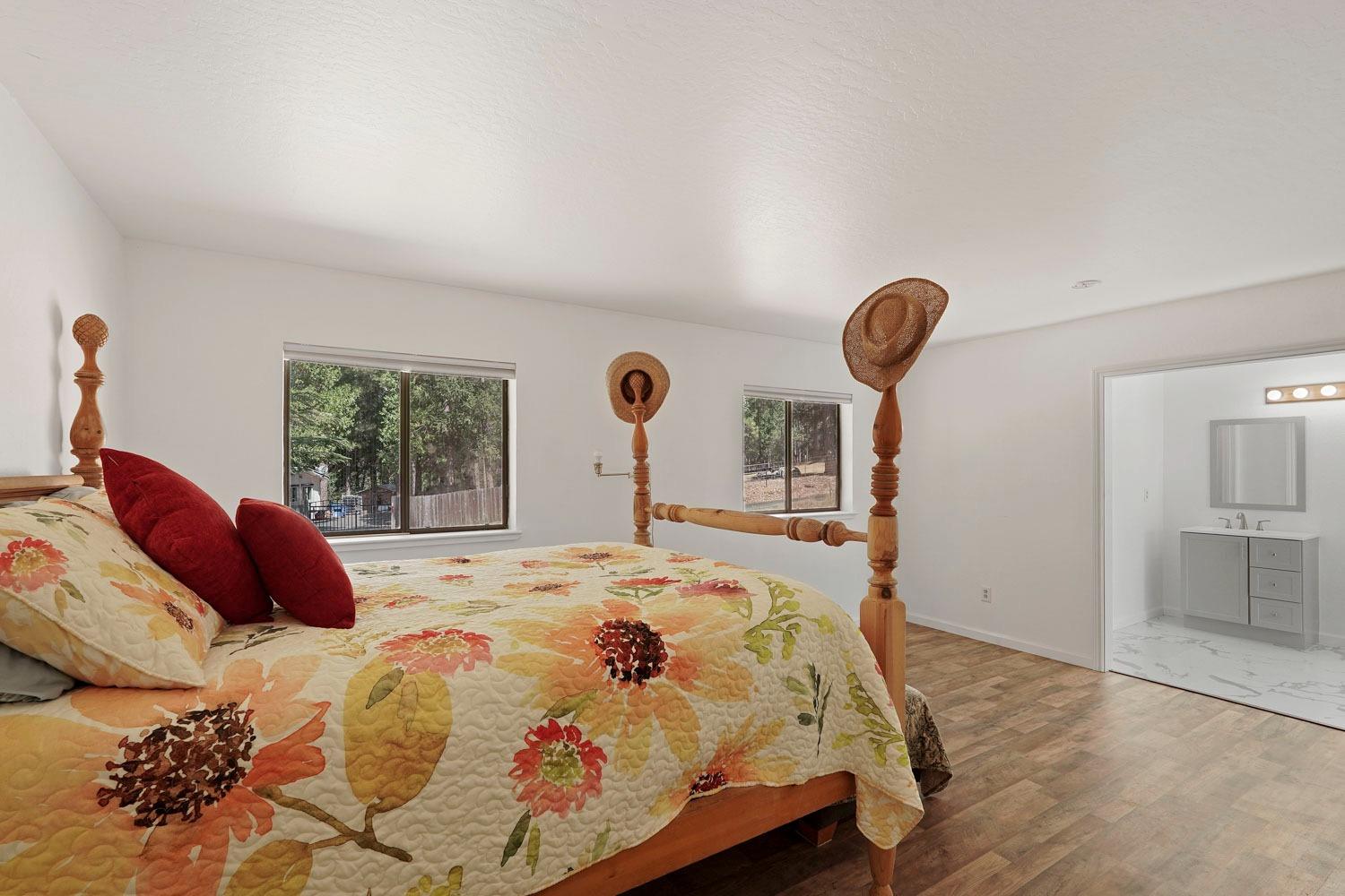 402 Rabbit's Foot Road West Point, CA 95255 - Photo 16 of 65 a bedroom with a bed and a large window