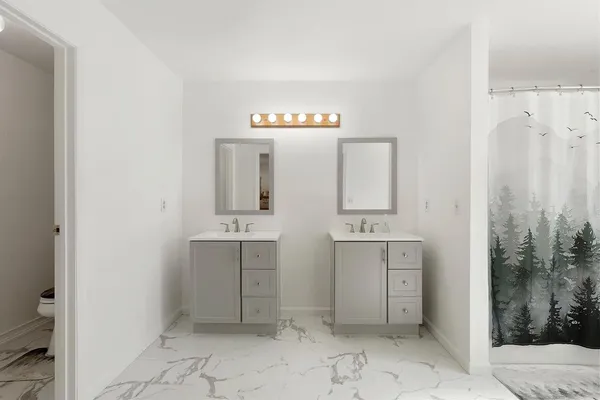 a bed room with a bed and a window