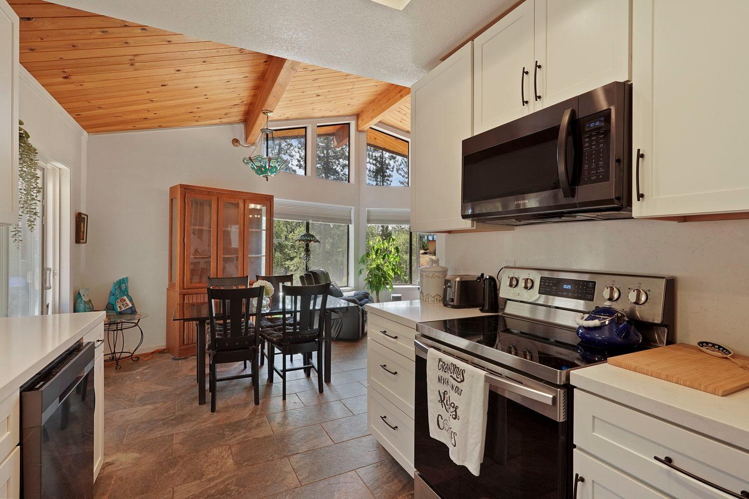 402 Rabbit's Foot Road West Point, CA 95255 - Photo 3 of 65 a kitchen with a stove and a microwave