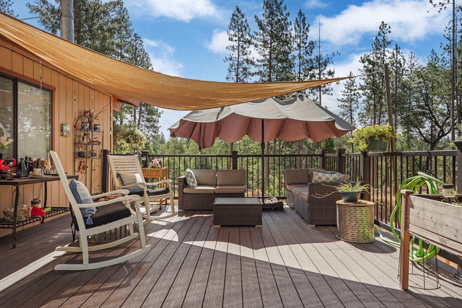 402 Rabbit's Foot Road West Point, CA 95255 - Photo 34 of 65 an outdoor sitting area with furniture and wooden floor