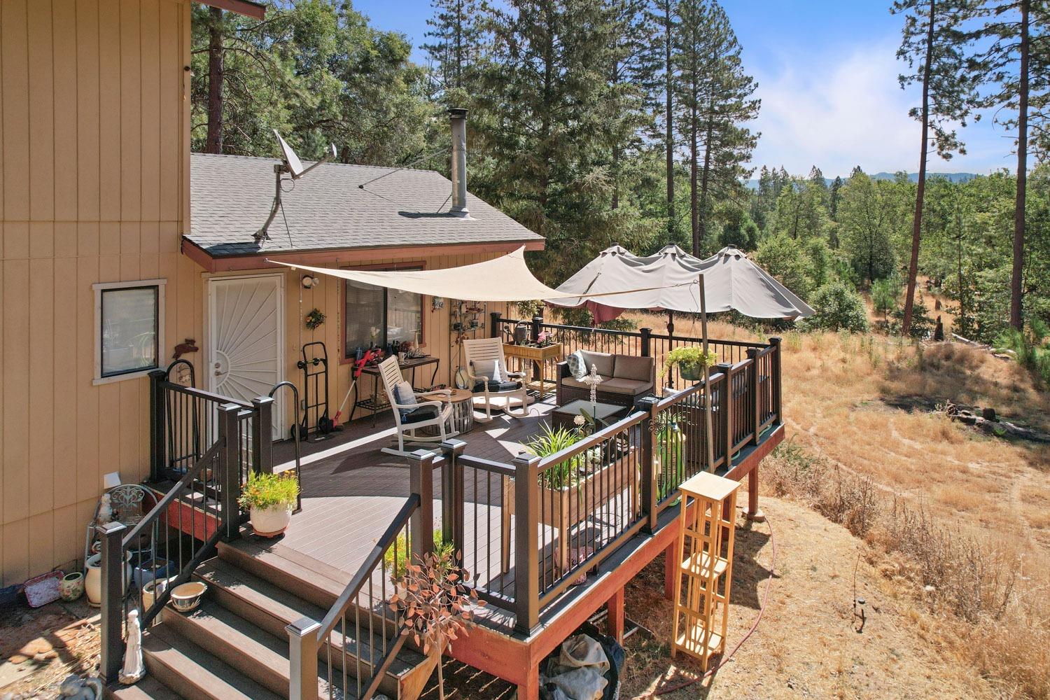 402 Rabbit's Foot Road West Point, CA 95255 - Photo 36 of 65 a view of a dinning table and chairs in the patio