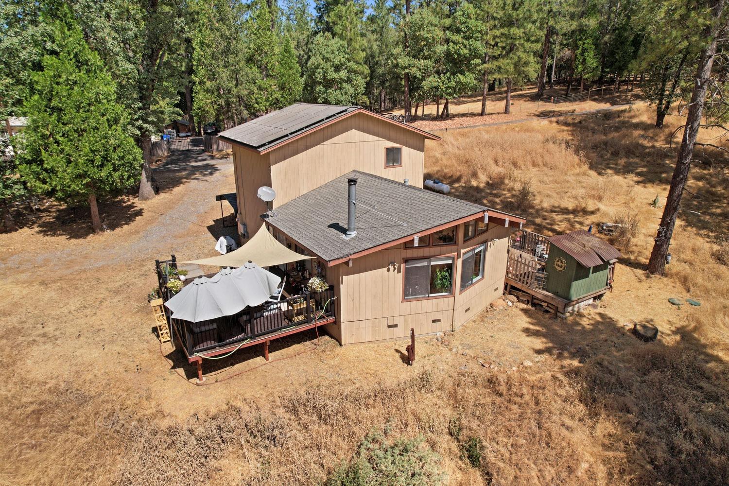 402 Rabbit's Foot Road West Point, CA 95255 - Photo 56 of 65 an aerial view of a house with yard and trees in the background