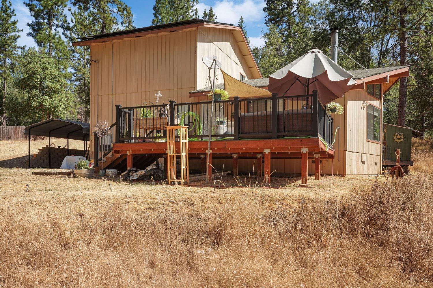 402 Rabbit's Foot Road West Point, CA 95255 - Photo 59 of 65 a front view of a house with large trees