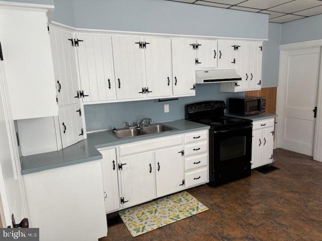 411 East Chestnut Street Lebanon, PA 17042 - Photo 13 of 48 a kitchen with granite countertop a white stove top oven and cabinets