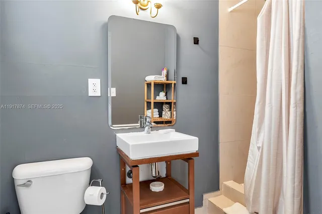 a view of bathroom with a toilet