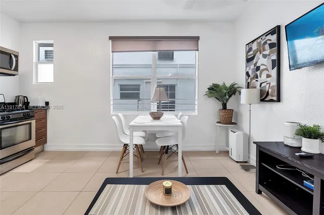 a dining room with furniture and window