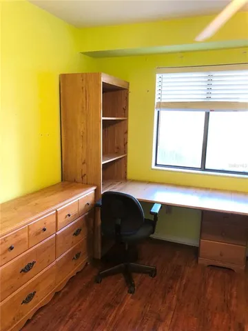a room with a desk and chair