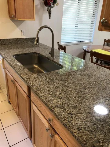 a kitchen with sink and bathtub