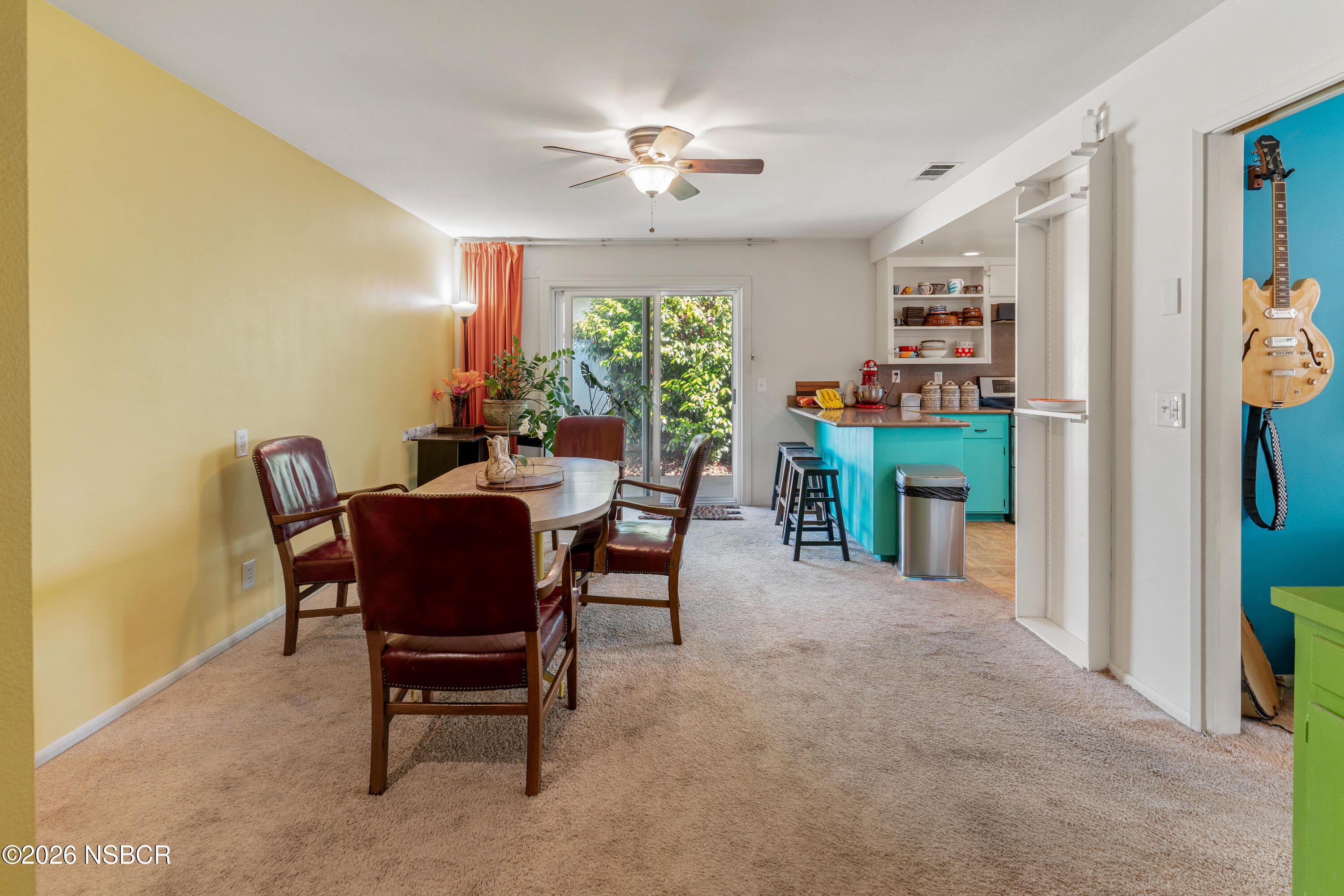 4220 Constellation Road Lompoc, CA 93436 - Photo 9 of 22 a dining room with furniture a rug and a potted plant