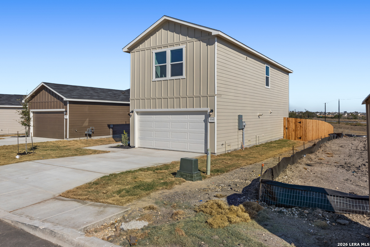 10045 Jagger Avenue Converse, TX 78109 - Photo 5 of 28 a view of a house with a yard