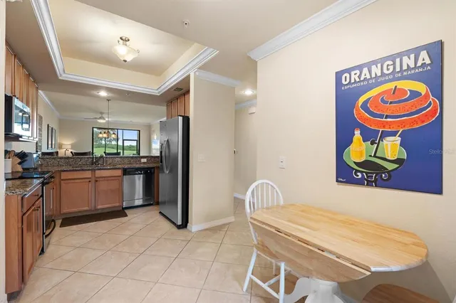 a kitchen with stainless steel appliances granite countertop a sink and cabinets
