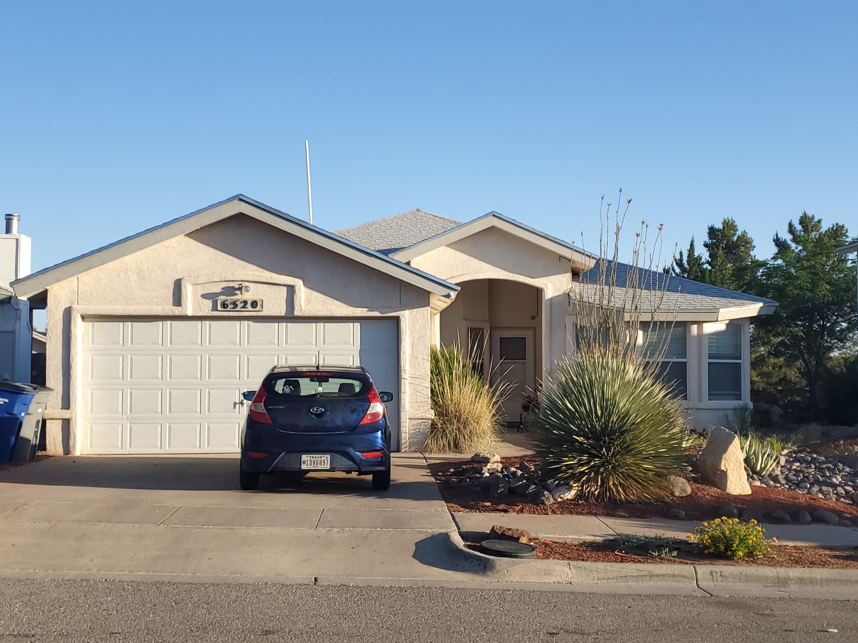 6520 Boulder Ridge El Paso, TX 79912 - Photo 1 of 1 a front view of a house with a garden