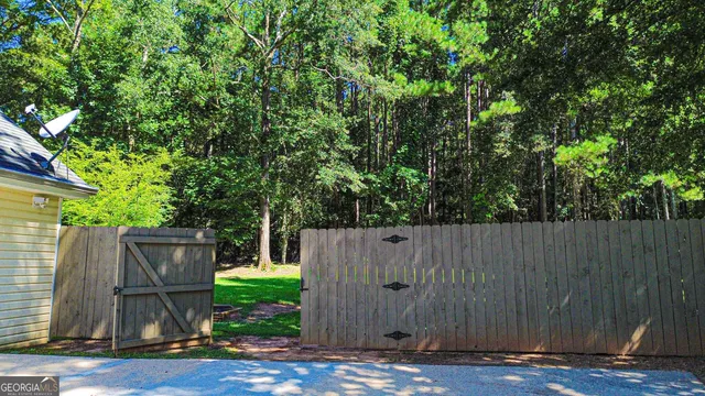 a living room with fireplace furniture and a flat screen tv