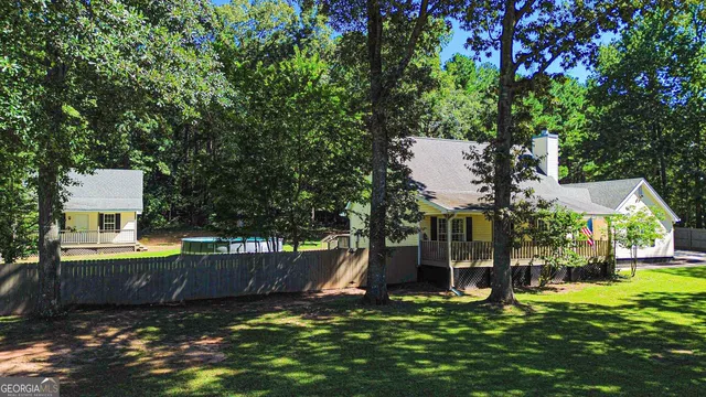 a backyard of a house with lots of green space