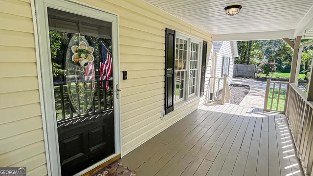 a bedroom with a large bed and a large window