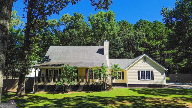 a view of a house with a tree