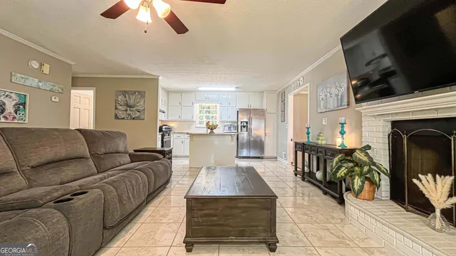 a front view of a house with a yard garage and trees
