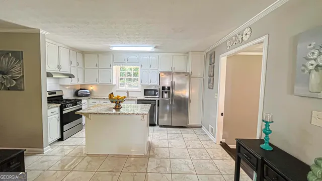 a backyard of a house with lots of green space and garden