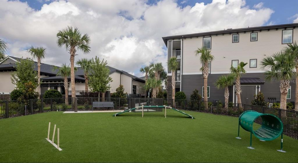 5000 Collina Terrace, Unit TH1 Clermont, FL 34711 - Photo 20 of 28 a house with garden in front of it