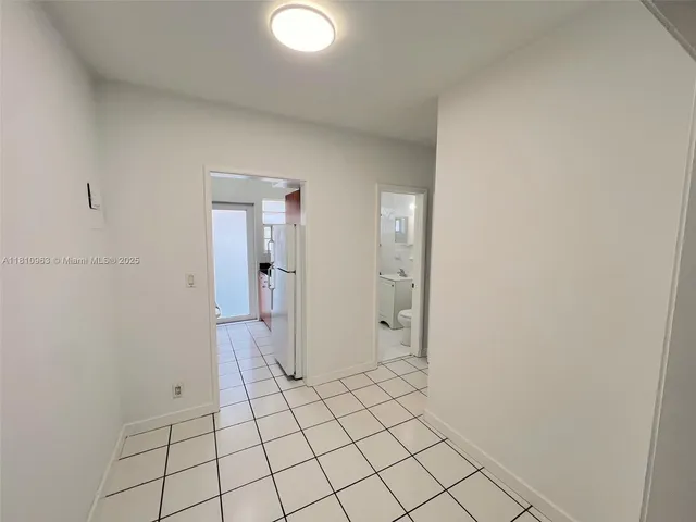 a kitchen with a sink a stove and a refrigerator