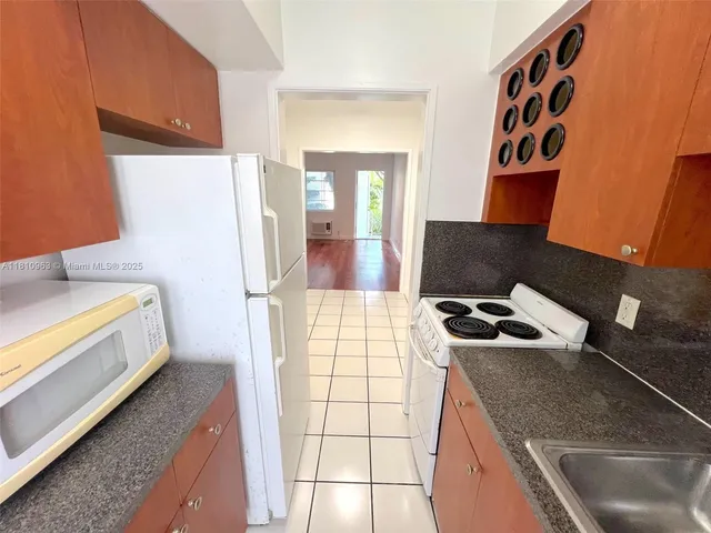 a bathroom with a sink a toilet and bathtub