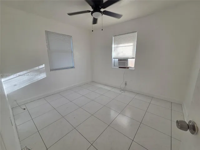 a white toilet sitting next to a bathroom sink and a shower