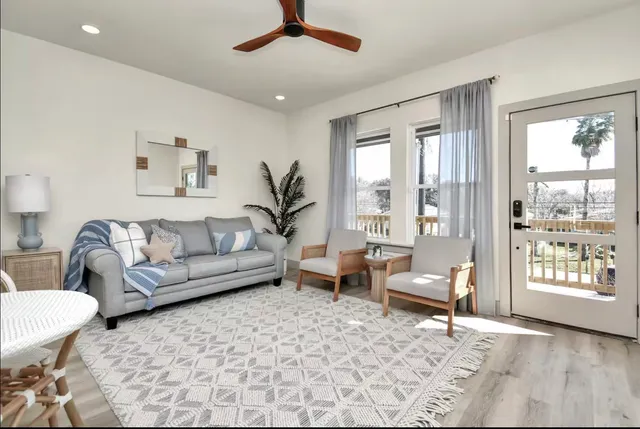 a living room with furniture and a large window