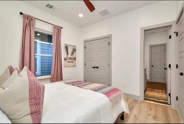 a bedroom with a bed and a dresser