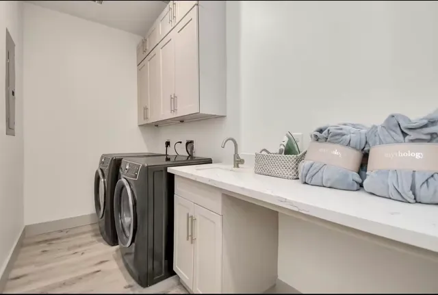 a utility room with dryer and washer