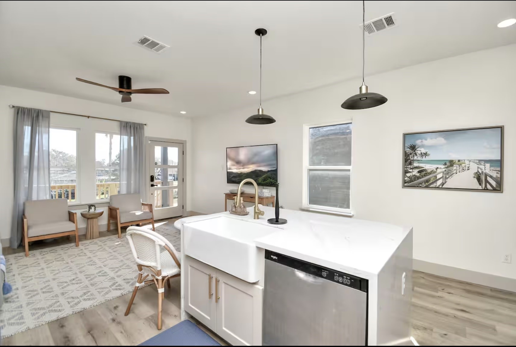 442 6th Street Dickinson, TX 77539 - Photo 10 of 29 a room with a chandelier a sink and a large window