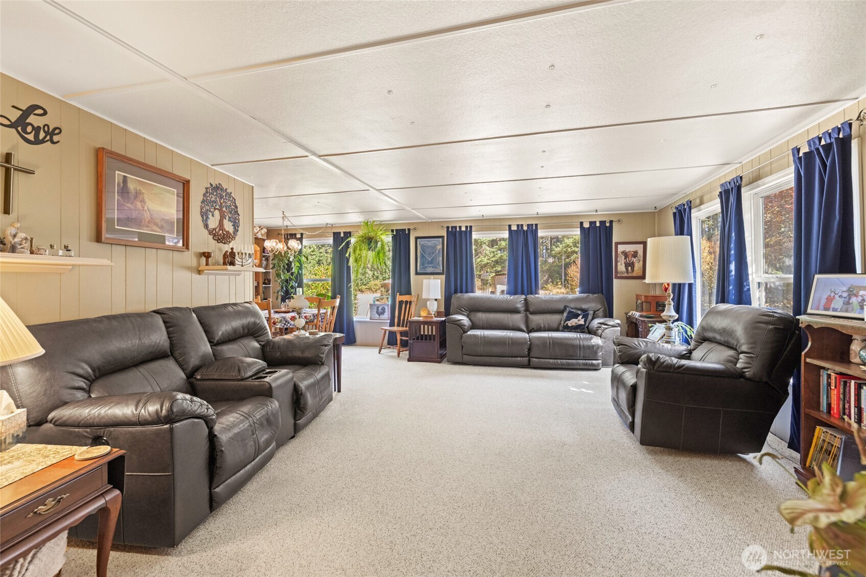 3167 Hunt Road Oak Harbor, WA 98277 - Photo 11 of 40 a living room with furniture and a floor to ceiling window