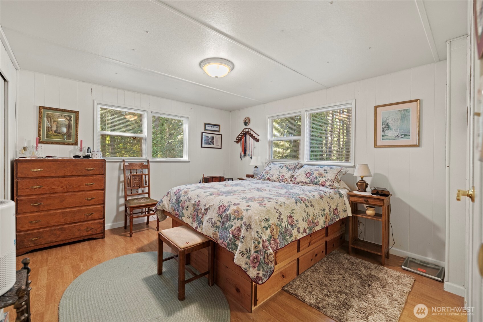 3167 Hunt Road Oak Harbor, WA 98277 - Photo 21 of 40 a bedroom with a bed and wooden floor
