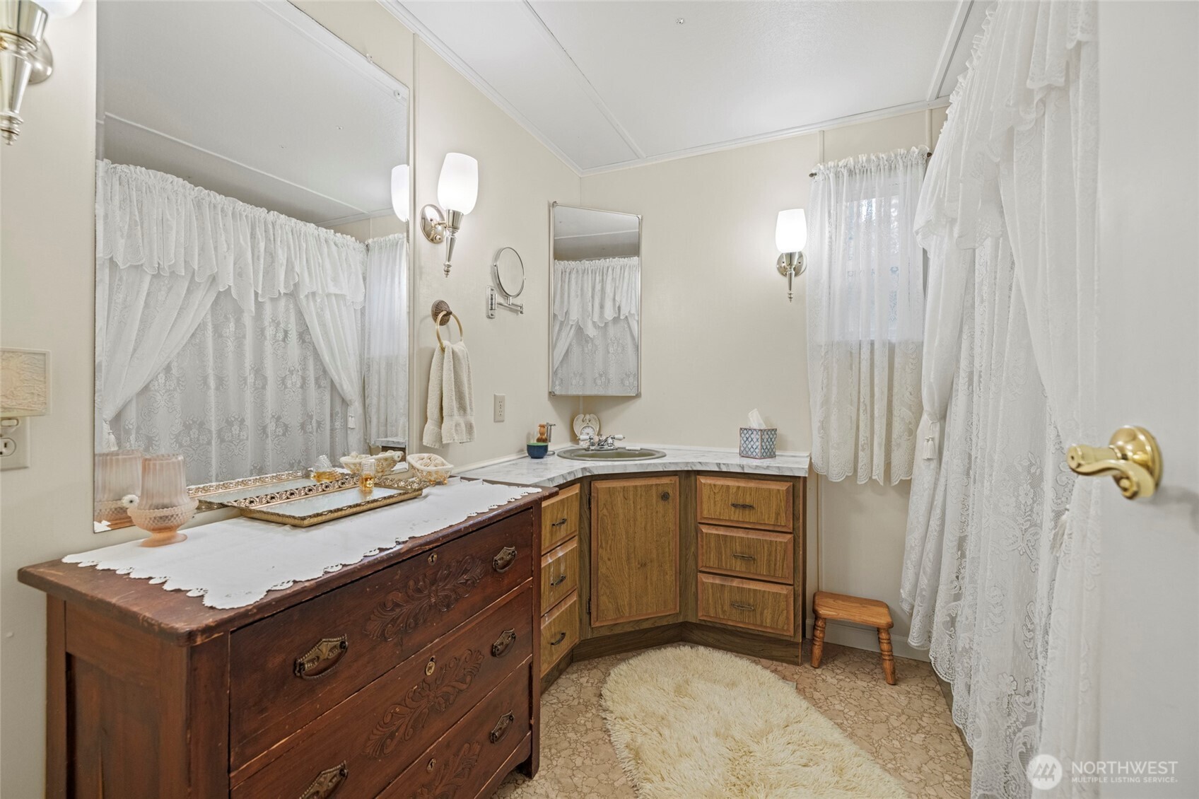 3167 Hunt Road Oak Harbor, WA 98277 - Photo 24 of 40 a spacious bathroom with a granite countertop sink and a mirror