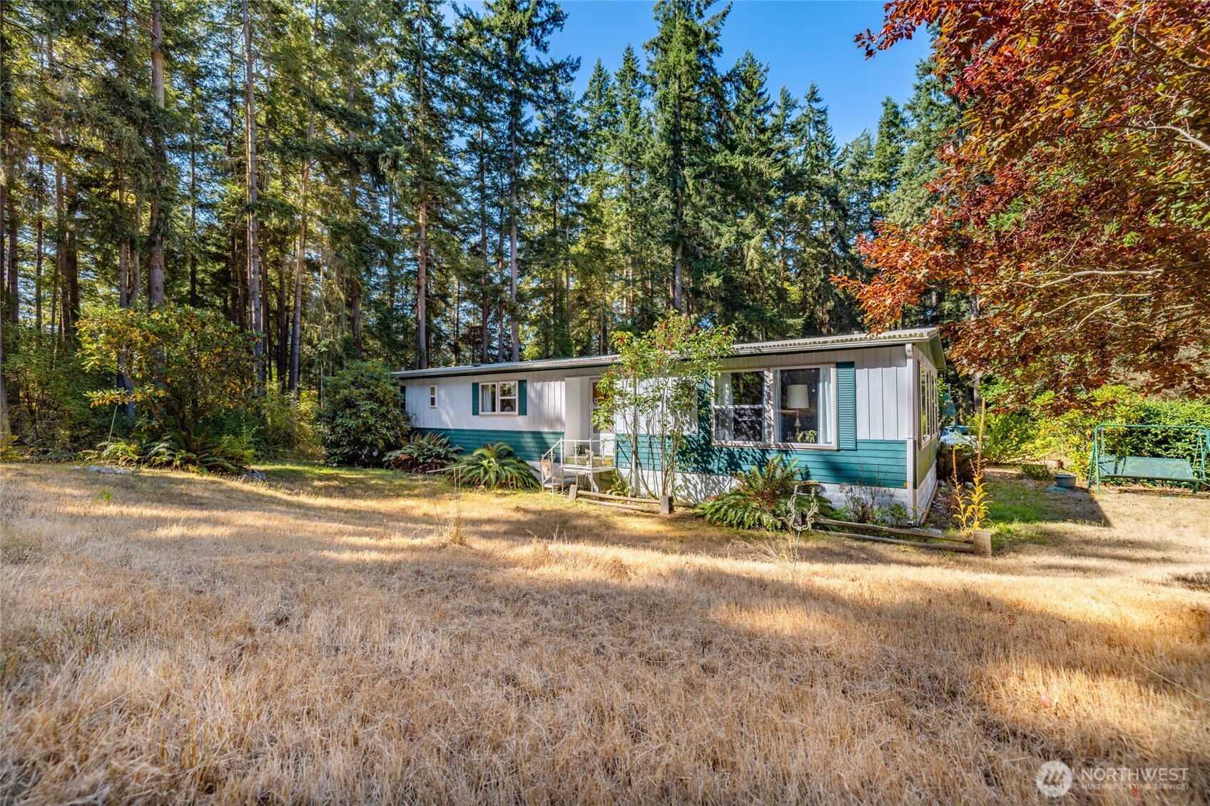 3167 Hunt Road Oak Harbor, WA 98277 - Photo 29 of 40 a view of a house with backyard and trees