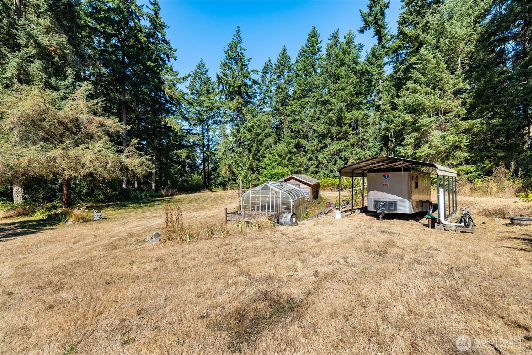 3167 Hunt Road Oak Harbor, WA 98277 - Photo 31 of 40 a white house that has a tree in front of it