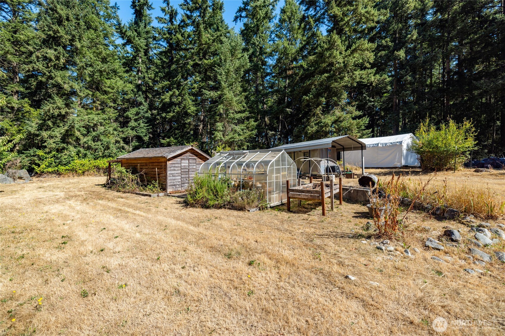 3167 Hunt Road Oak Harbor, WA 98277 - Photo 32 of 40 a view of a house with backyard