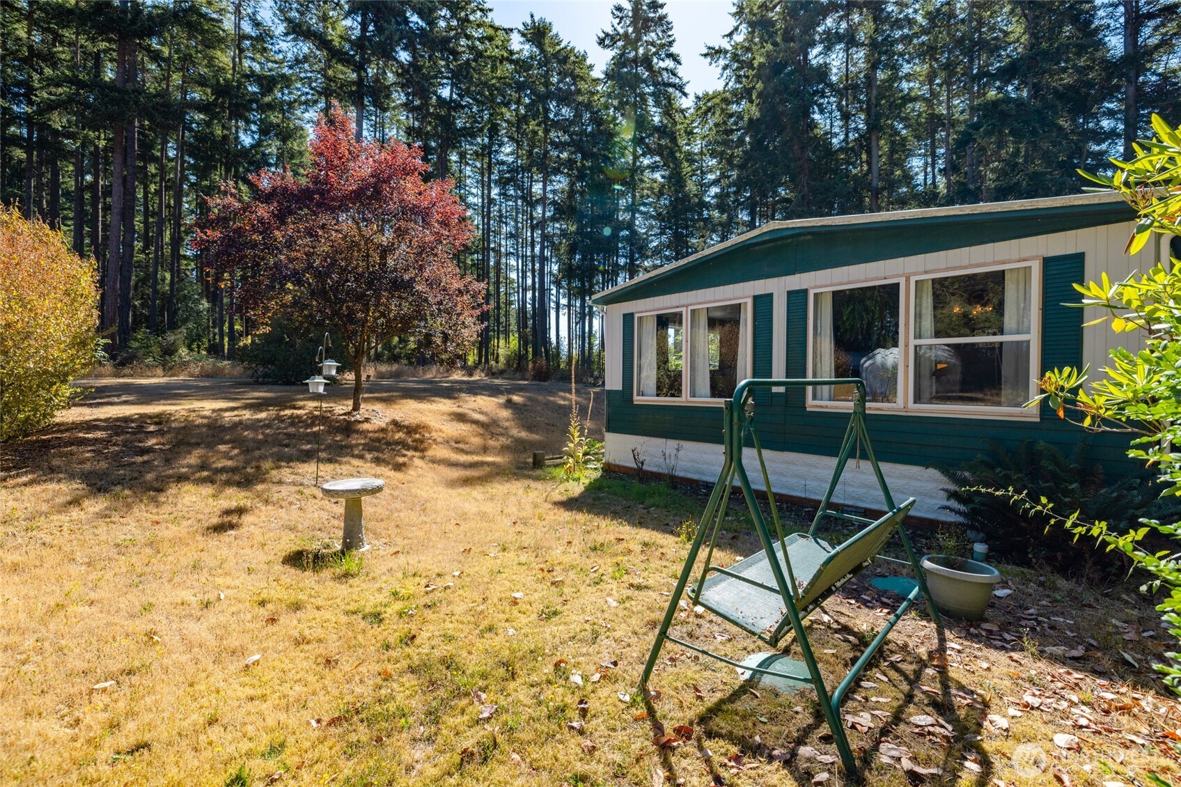 3167 Hunt Road Oak Harbor, WA 98277 - Photo 35 of 40 a view of a house with backyard and sitting area