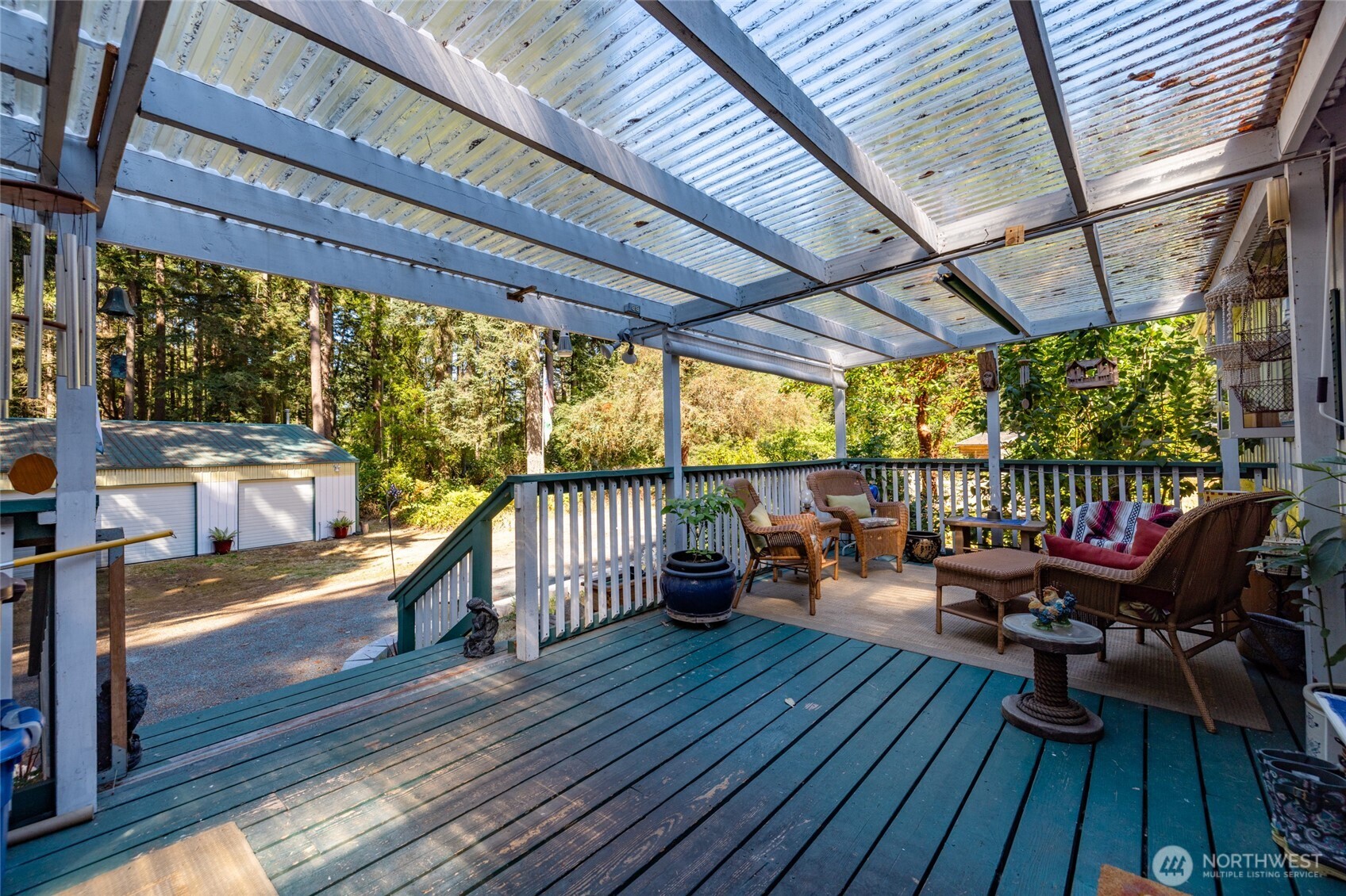3167 Hunt Road Oak Harbor, WA 98277 - Photo 37 of 40 a balcony with wooden floors and outdoor seating